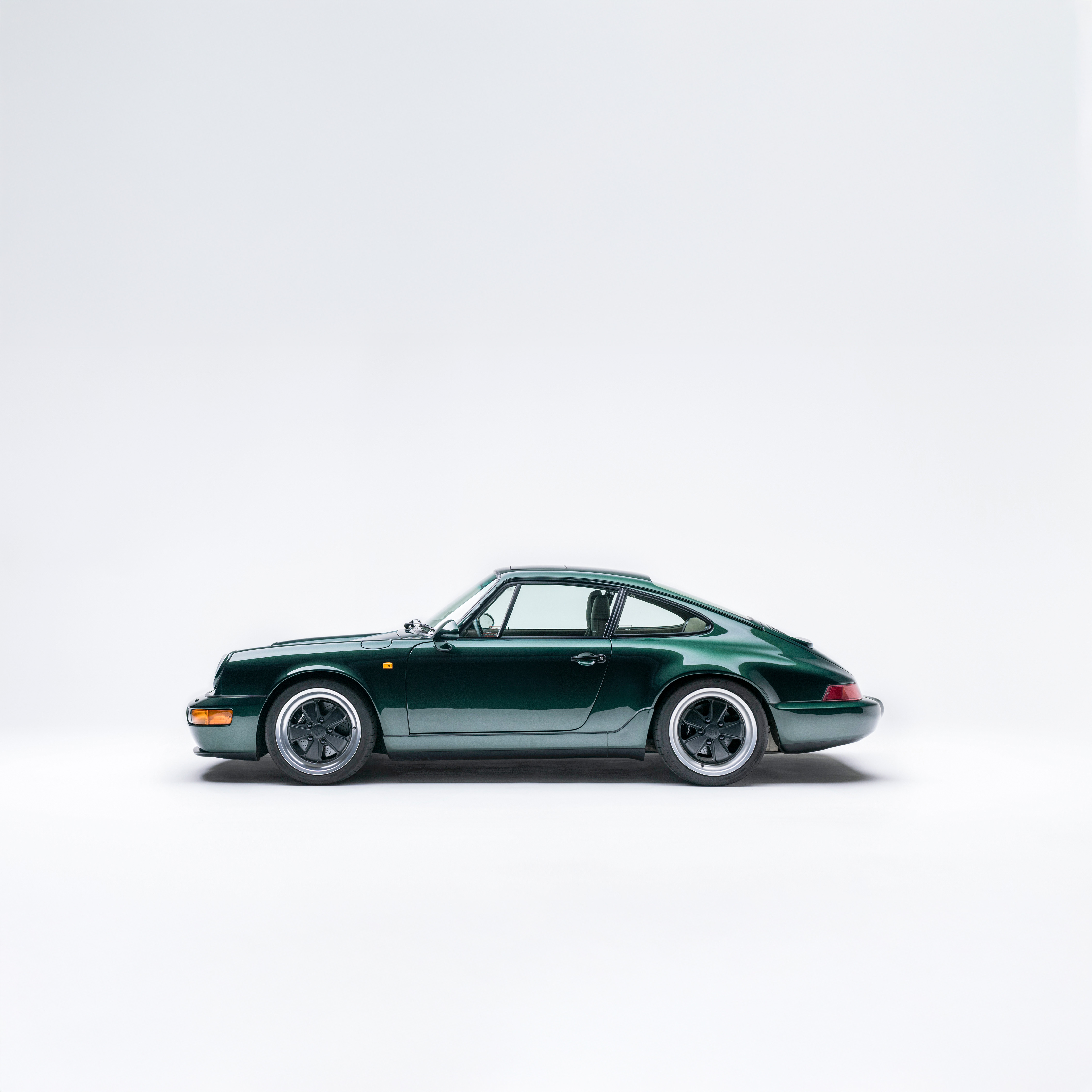 Porsche 964 Carrera 4 in Forest Green Metallic — side profile